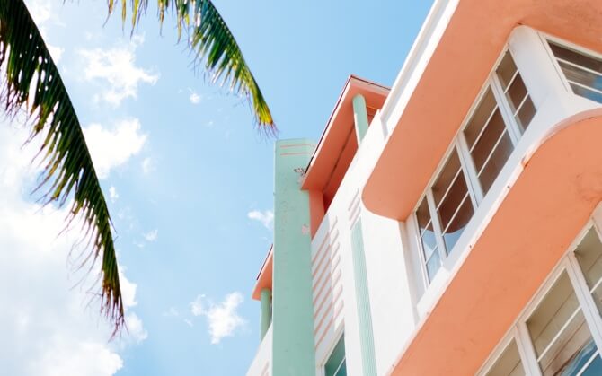 upward view of a pastel colored beach house